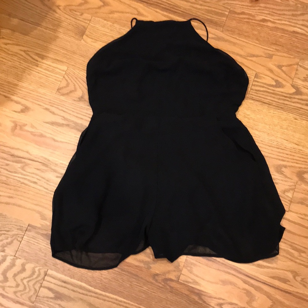 Short black romper with open back
